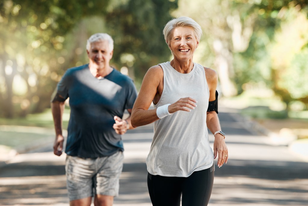 two senior runners starting running again