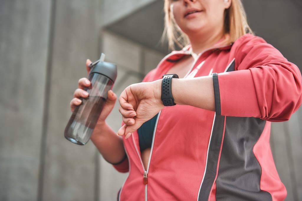 runner looking at her smartwatch